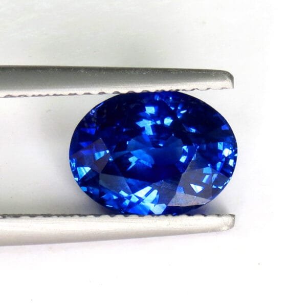 Close-up of natural 3.57 ct sapphire, oval brilliant cut, royal blue