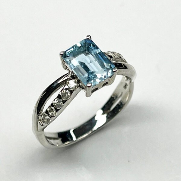 Sterling silver ring with emerald-cut aquamarine and white zircon accents