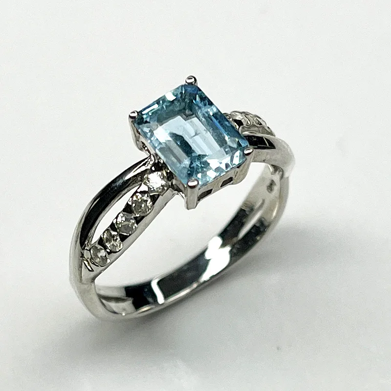 Sterling silver ring with emerald-cut aquamarine and white zircon accents