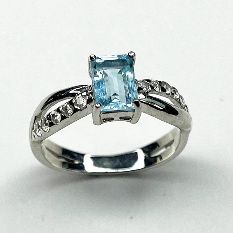 Elegant 925 silver ring featuring a light blue aquamarine gemstone with zircon side stones