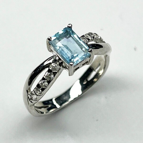Sterling silver ring with emerald-cut aquamarine and white zircon accents