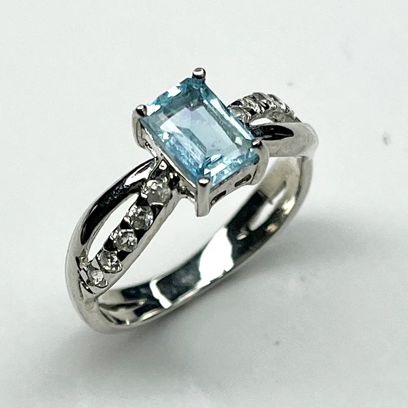 Sterling silver ring with emerald-cut aquamarine and white zircon accents