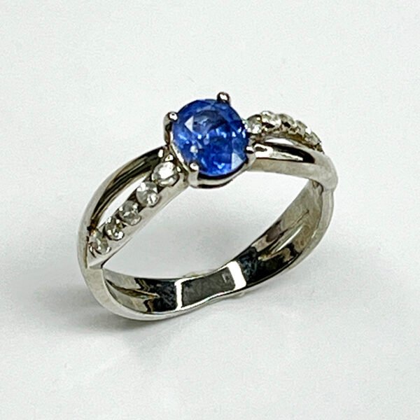 Sterling silver ring with natural blue sapphire and white zircon accents