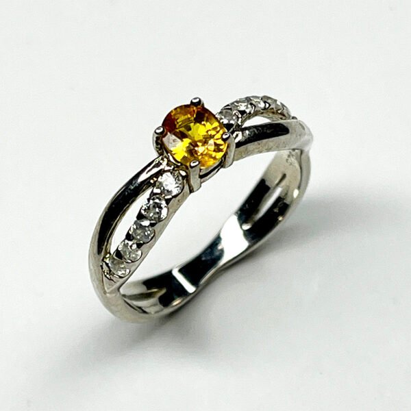 Elegant silver ring with vivid yellow sapphire and white zircon gemstones