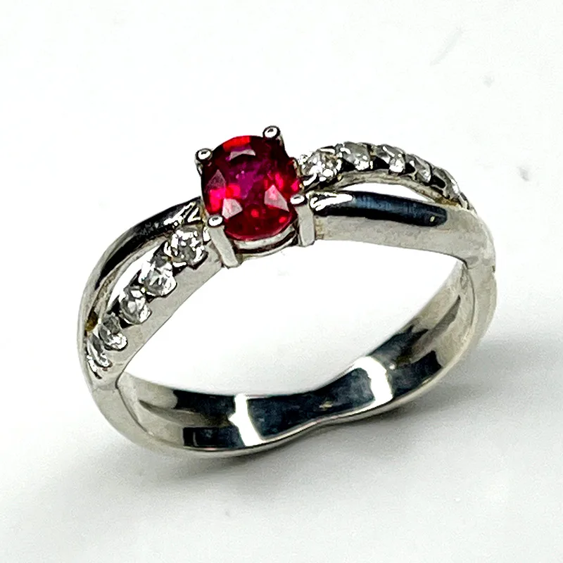 Sterling silver ring with natural treated ruby and white zircon accents