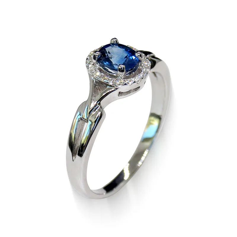 Elegant 18K White Gold Halo Ring with Oval Blue Sapphire – perspective view
