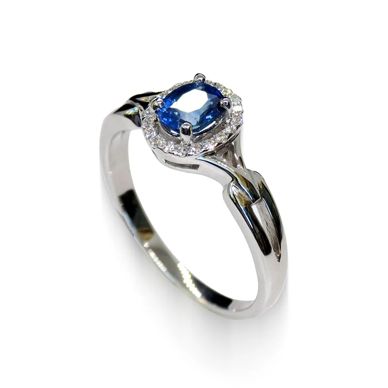 Oval Blue Sapphire Ring in 18K White Gold with Diamond Halo – angled view